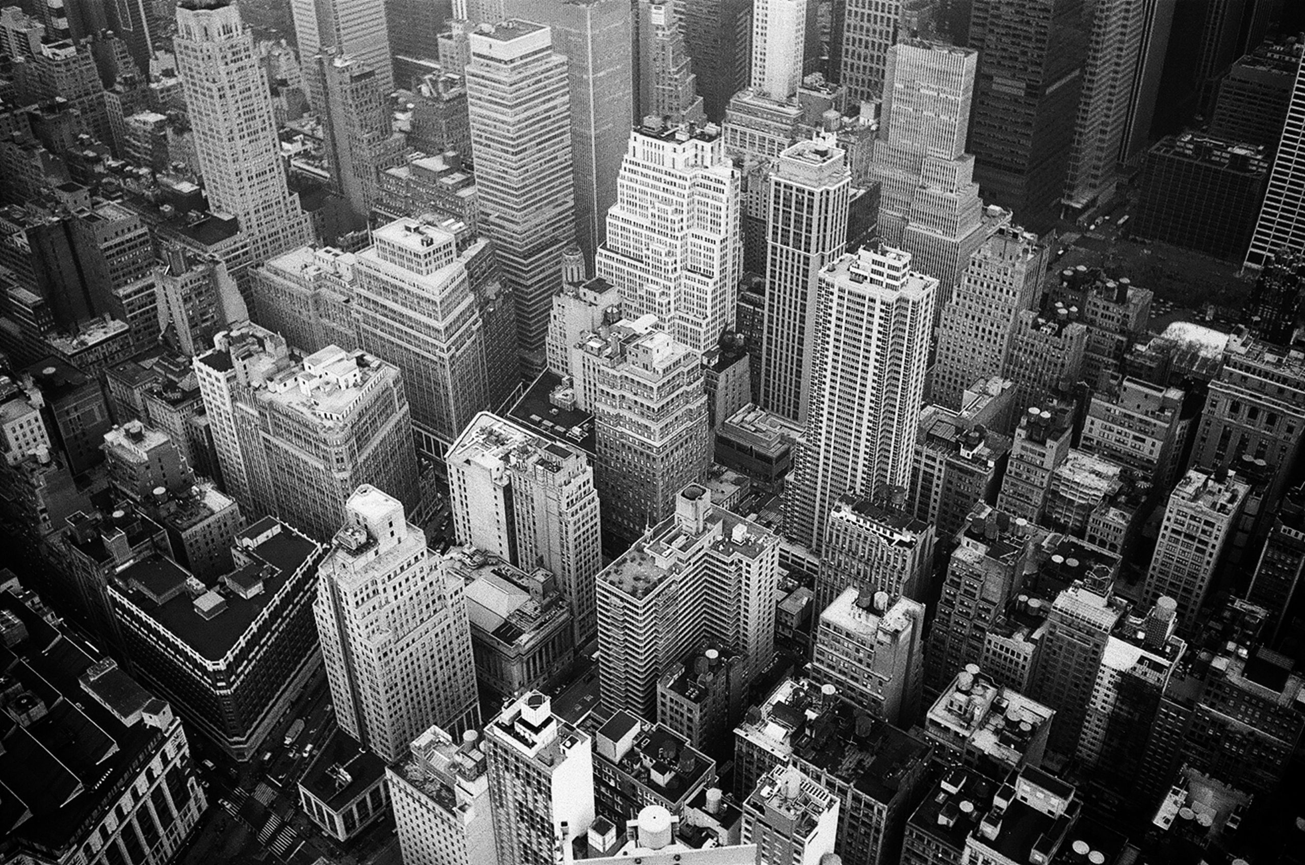 aerial-view-and-grayscale-photography-of-high-rise-buildings-1105766-scaled.jpg
